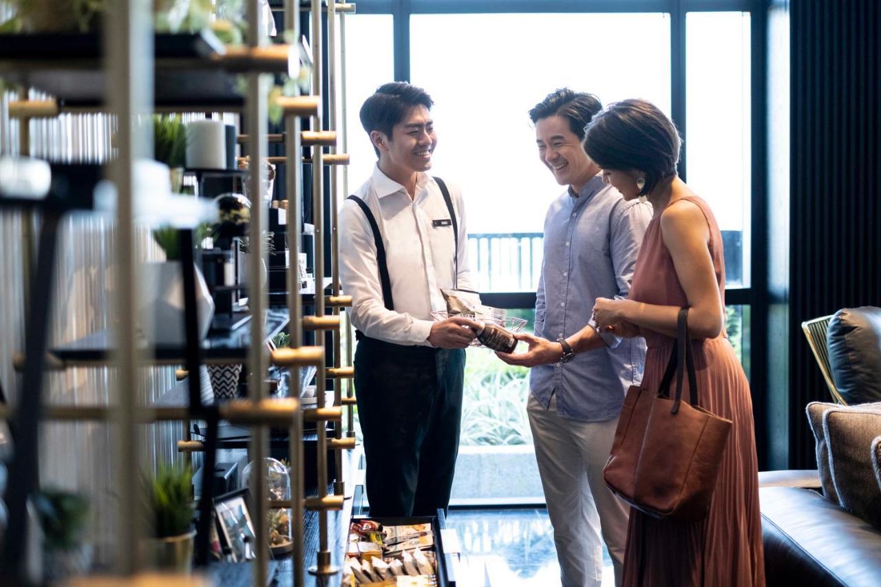 The Outpost Hotel Sentosa By Far East Hospitality (Adults Only) Сингапур Экстерьер фото A couple shopping at a store